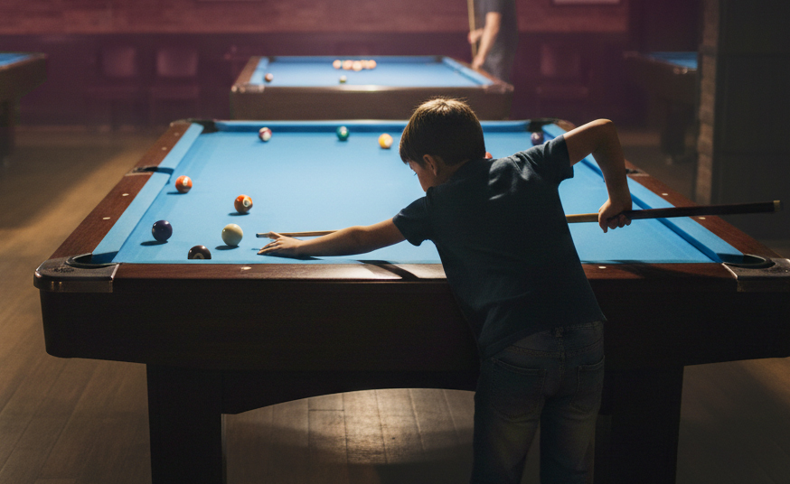 child playing on pool table