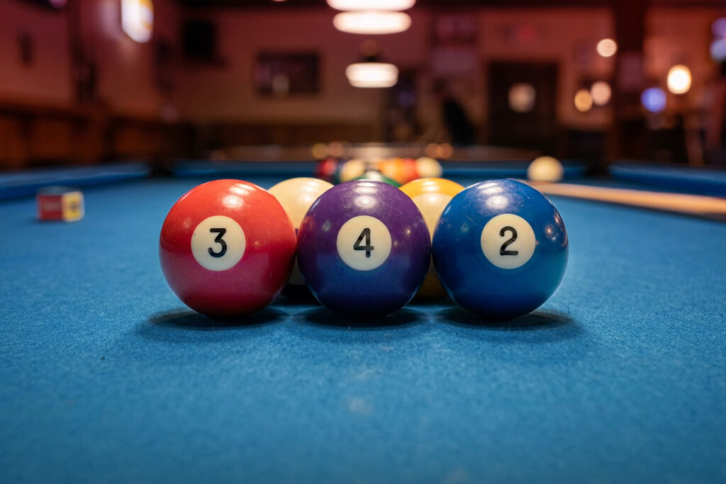 3 pool balls on table with numbers 3 4 2